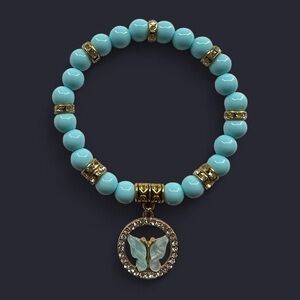 Blue and gold butterfly charm bracelet- 7.75 inches
